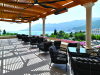 2A78M54 A Wicker chairs and table on the outdoor terrace